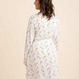 The back of the Women's Lounge Robe in Tulip shown on a model standing in front of a light taupe background