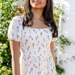 Close up of the smocked bodice on the Women’s Smocked Dress in Tulip shown on a female model