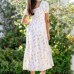 The back of the Women’s Smocked Dress in Tulip showing the square backline on a model