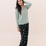 Smiling model with hand in hair while wearing the Women's Lounge Pants in Twinkle Tree