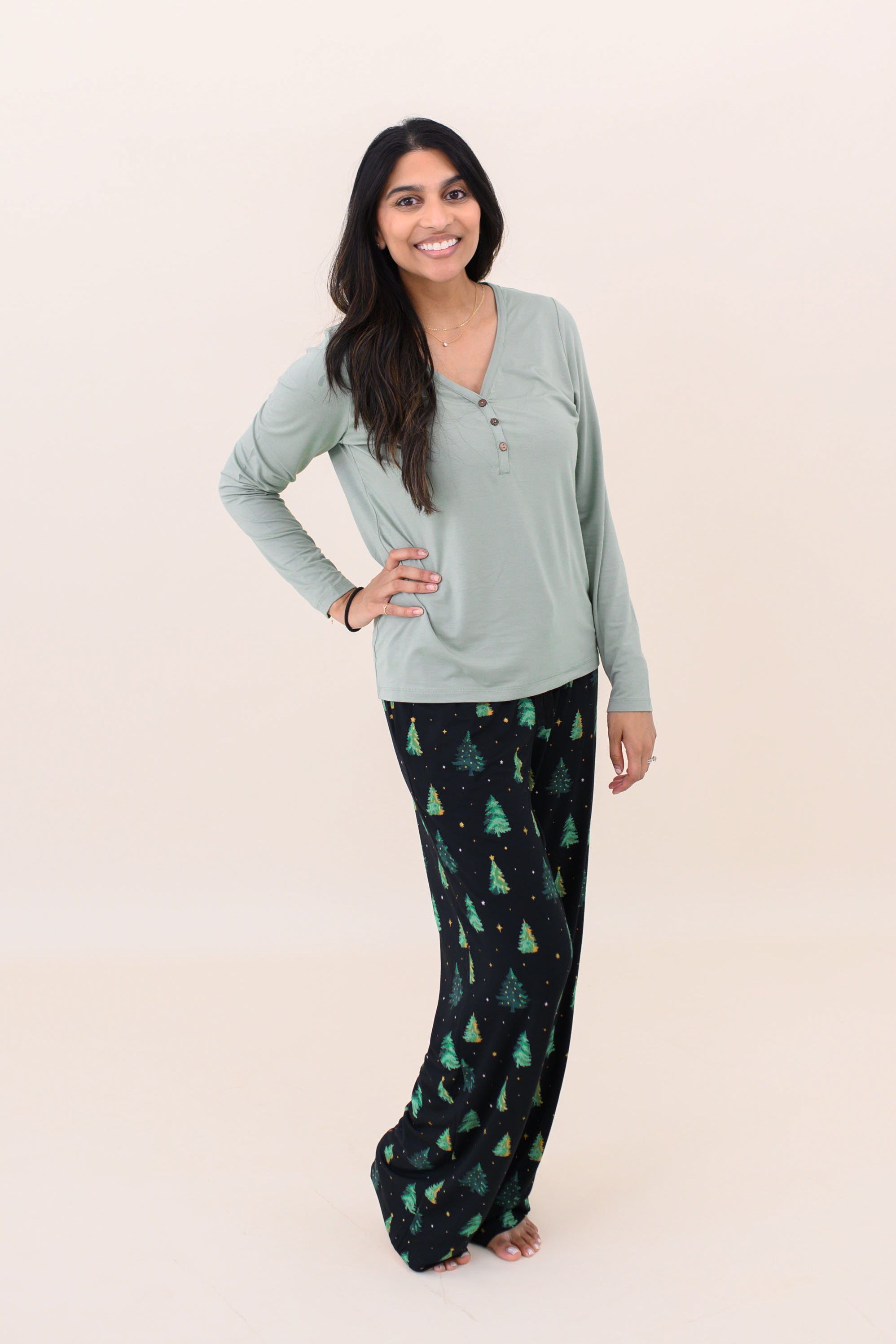 Woman with hand on her hip while modeling the Kyte Women's Lounge Pants in Twinkle Tree