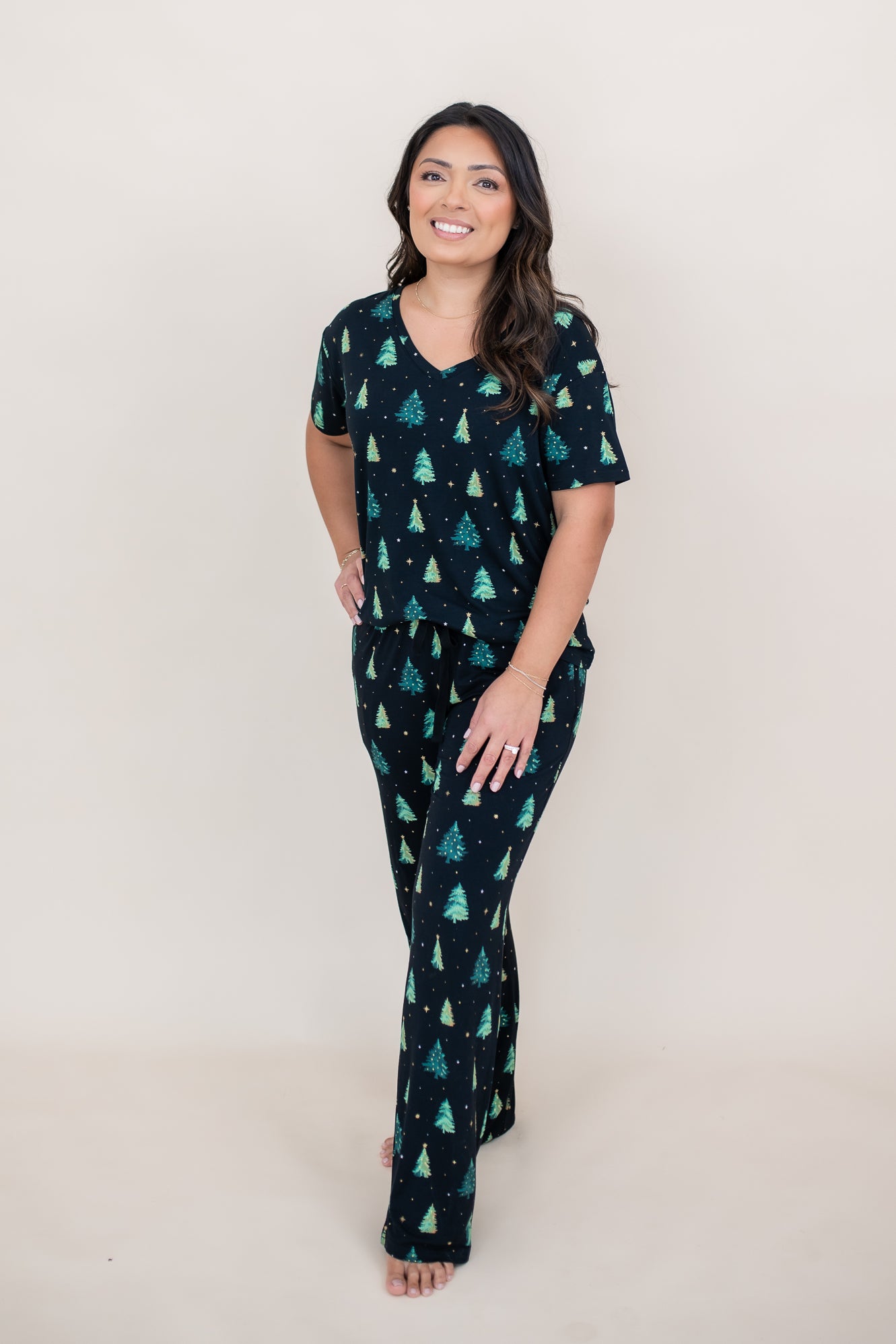 Model wearing the Women's Relaxed Fit V-Neck in Twinkle Tree paired with matching lounge pants