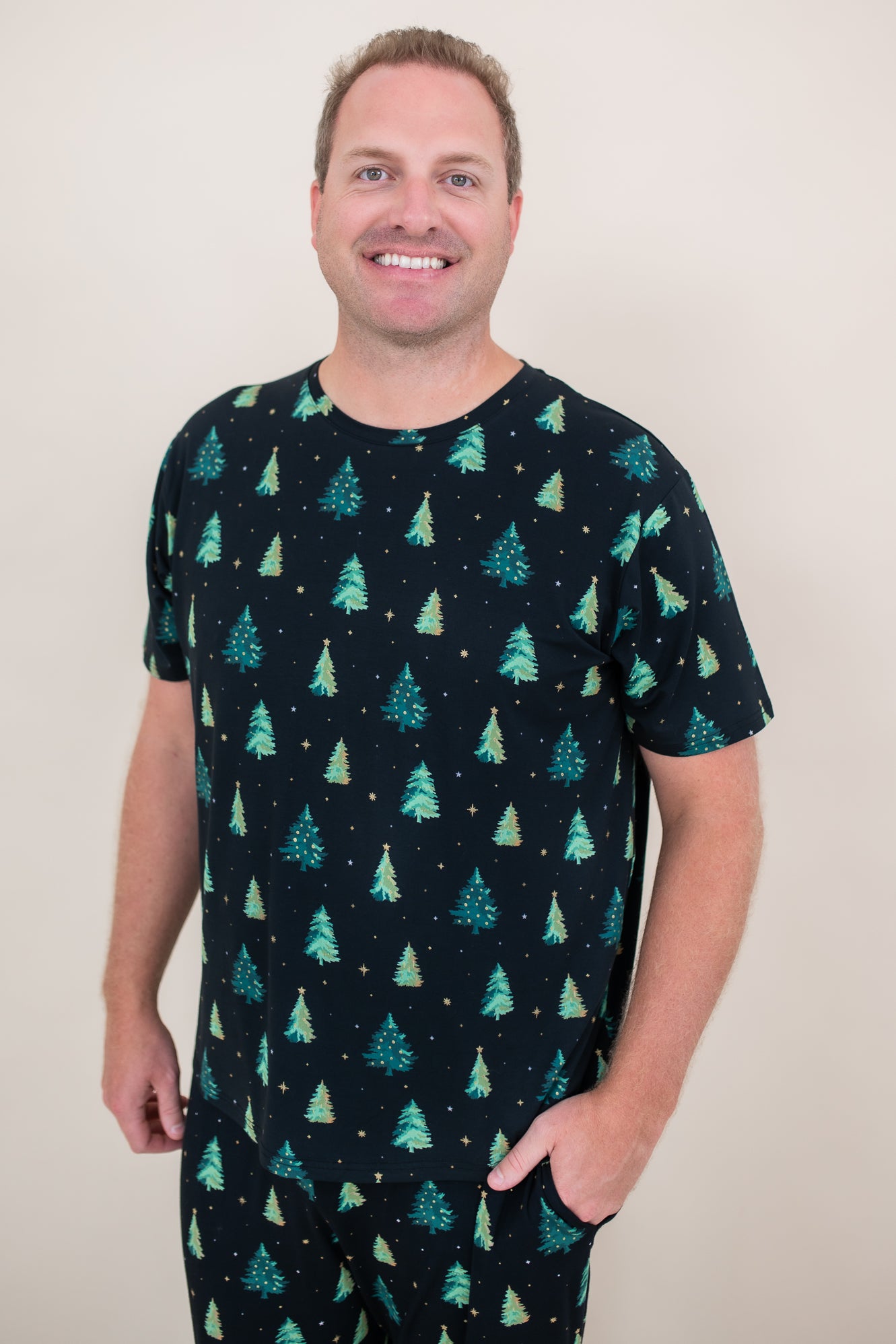 Man smiling while modeling the Men's Crew Neck Tee in Twinkle Tree
