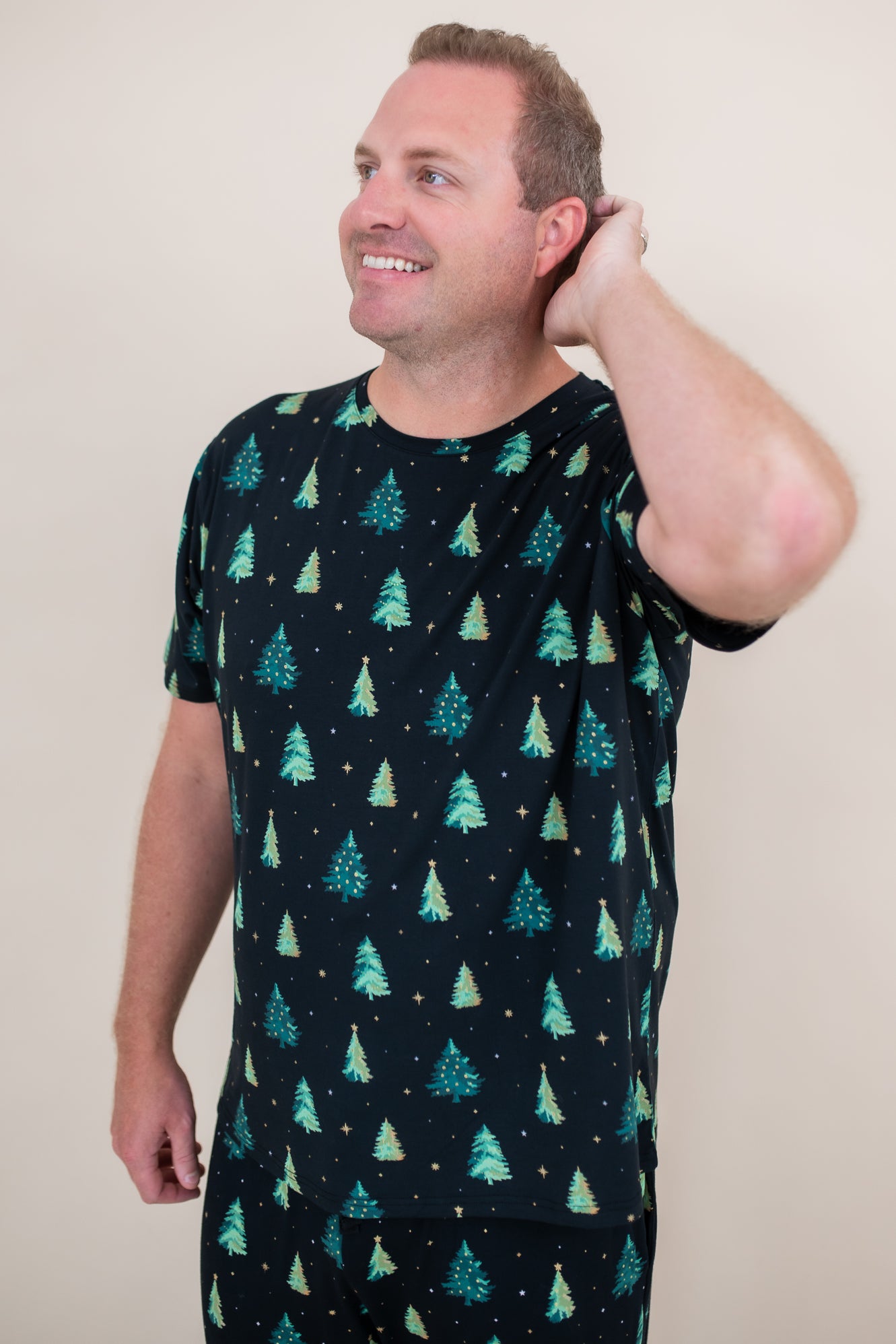 Model with hand in his head while wearing the Kyte Men's Crew Neck Tee in Twinkle Tree