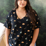 Woman modeling Women's Relaxed Fit V-Neck in Under the Stars with tree mural behind