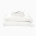Stack of white pillows on a white background