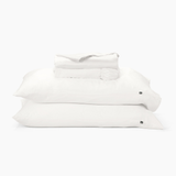 Stack of white pillows on a white background