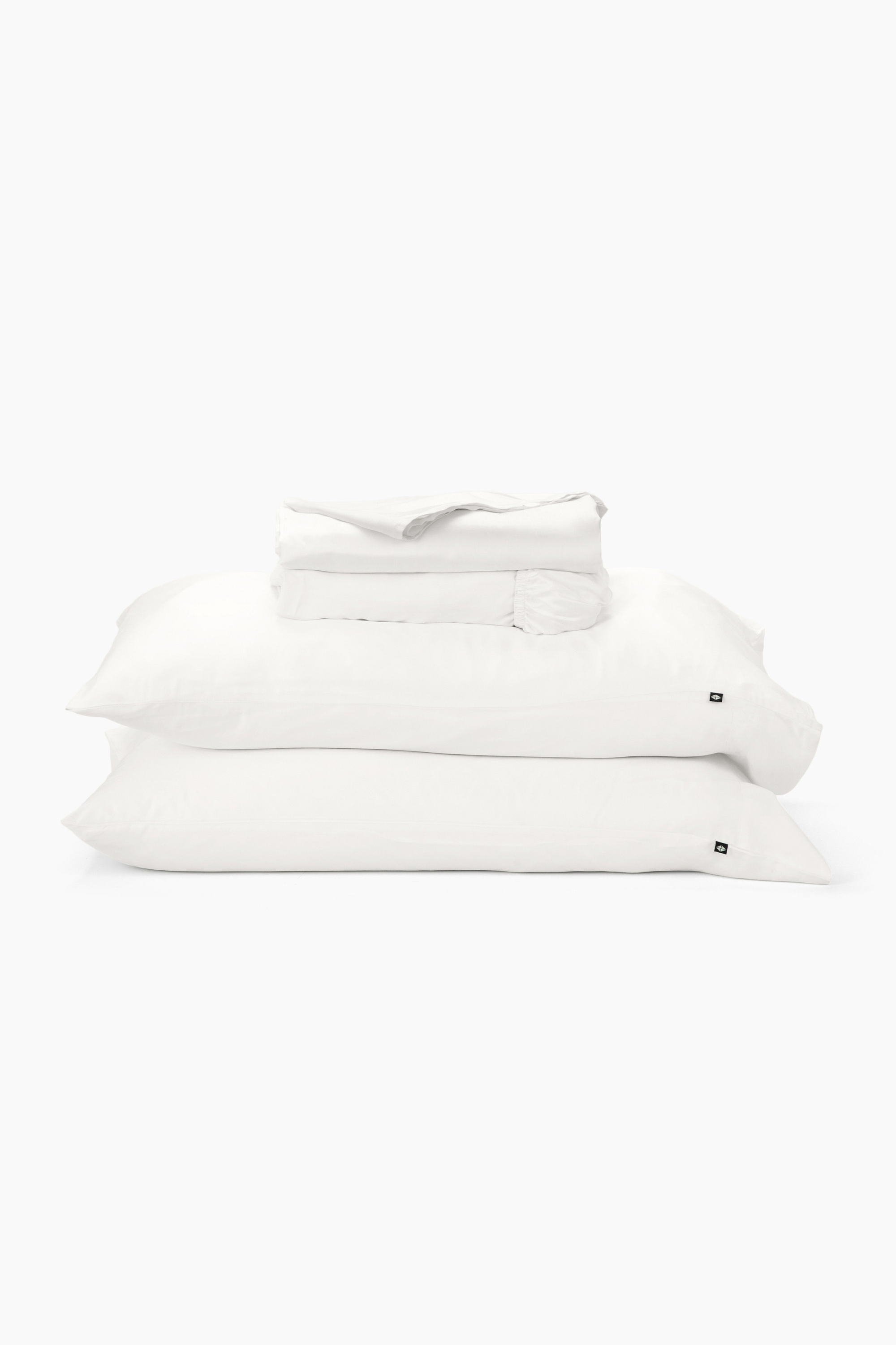 Stack of white pillows on a white background