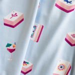 close up of fabric in light blue color with a pattern of pink mahjong