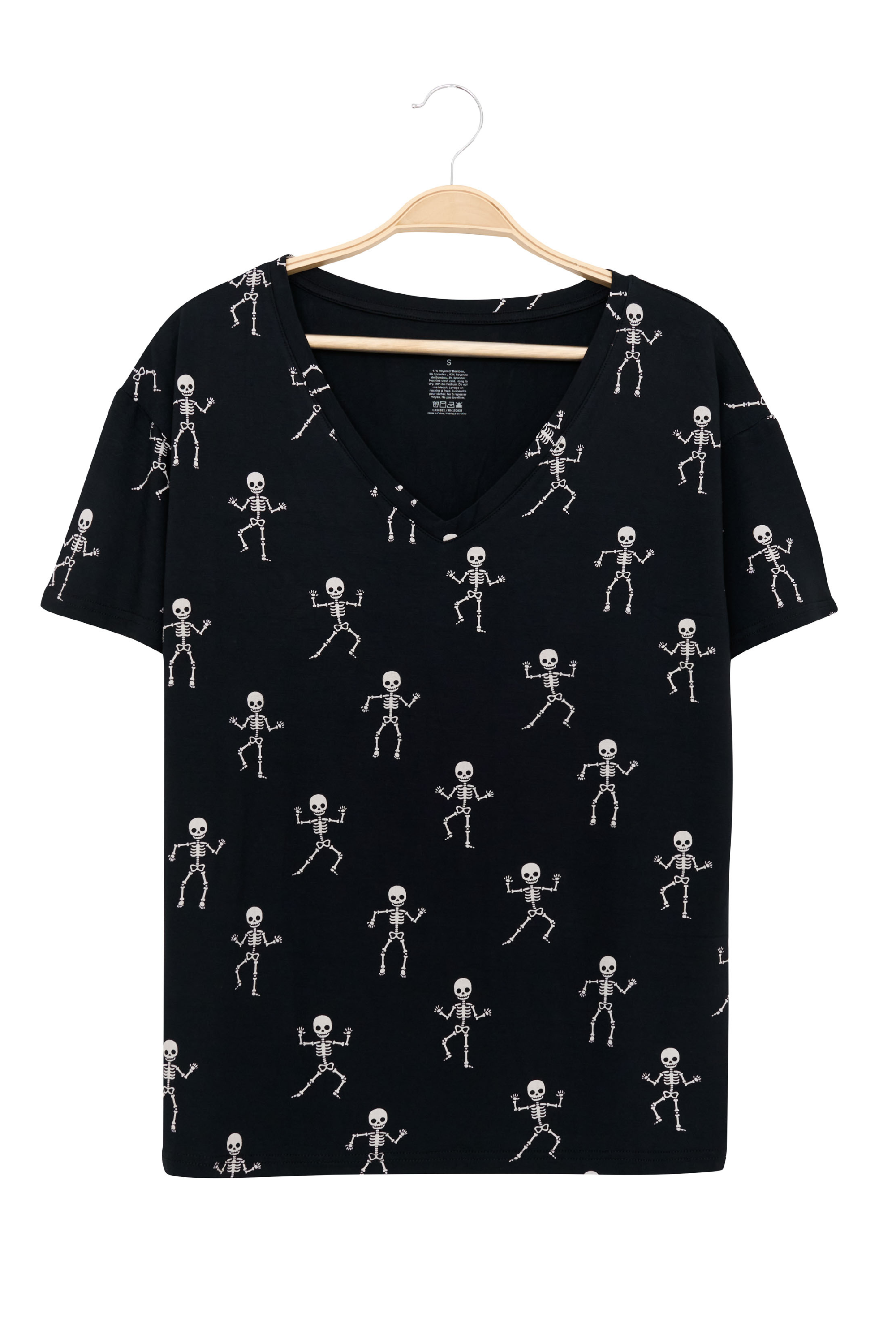 Women's black Relaxed Fit V-Neck with a skeleton print on a hanger with a white background