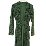 Green robe with leopard print pattern on a hanger against a white background