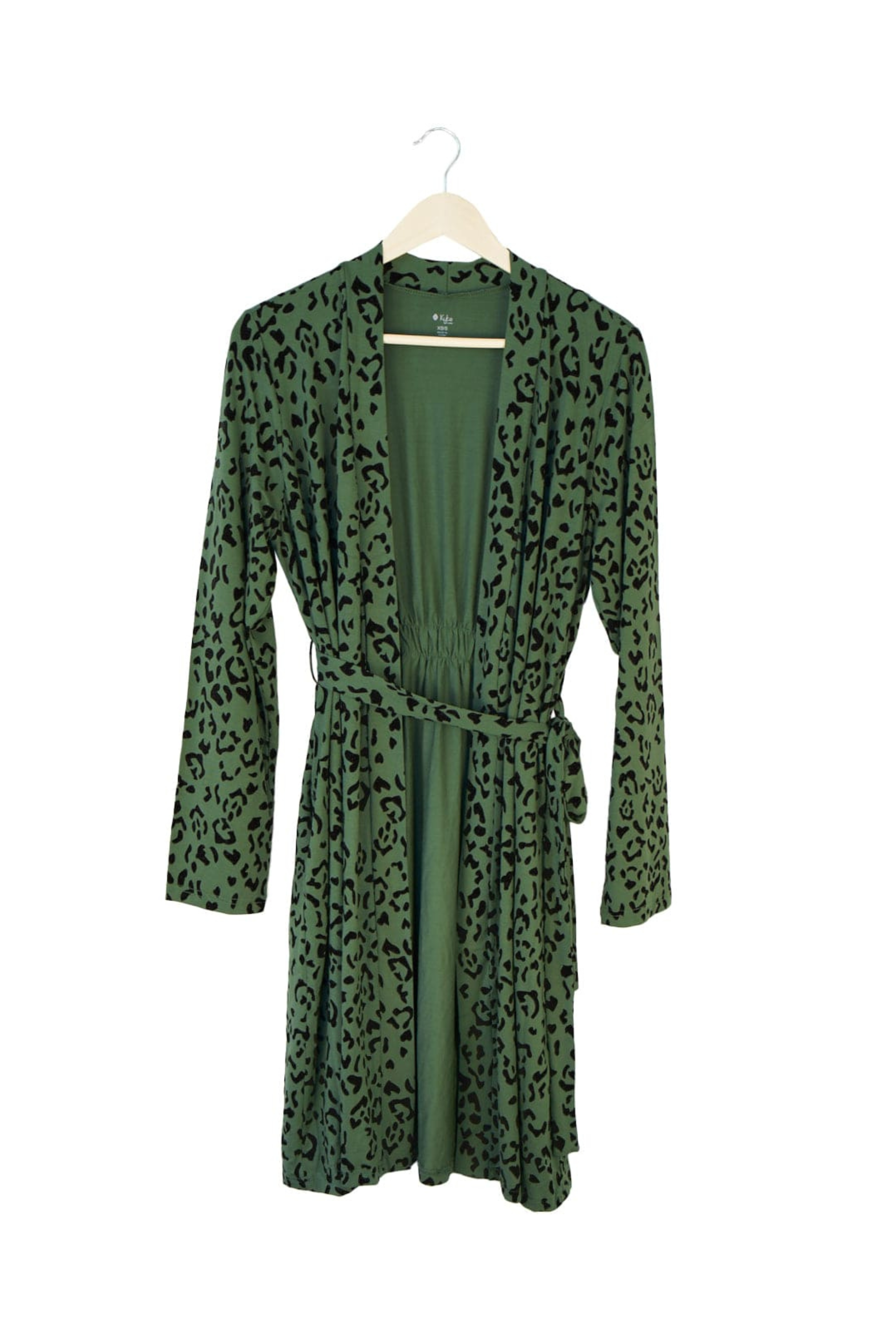 Green robe with leopard print pattern on a hanger against a white background