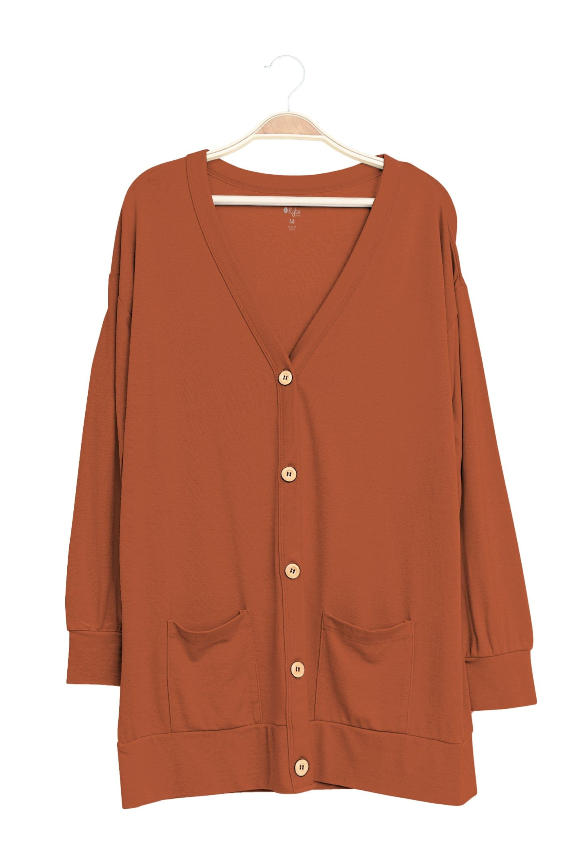 Rust color bamboo cardigan hanging on hanger