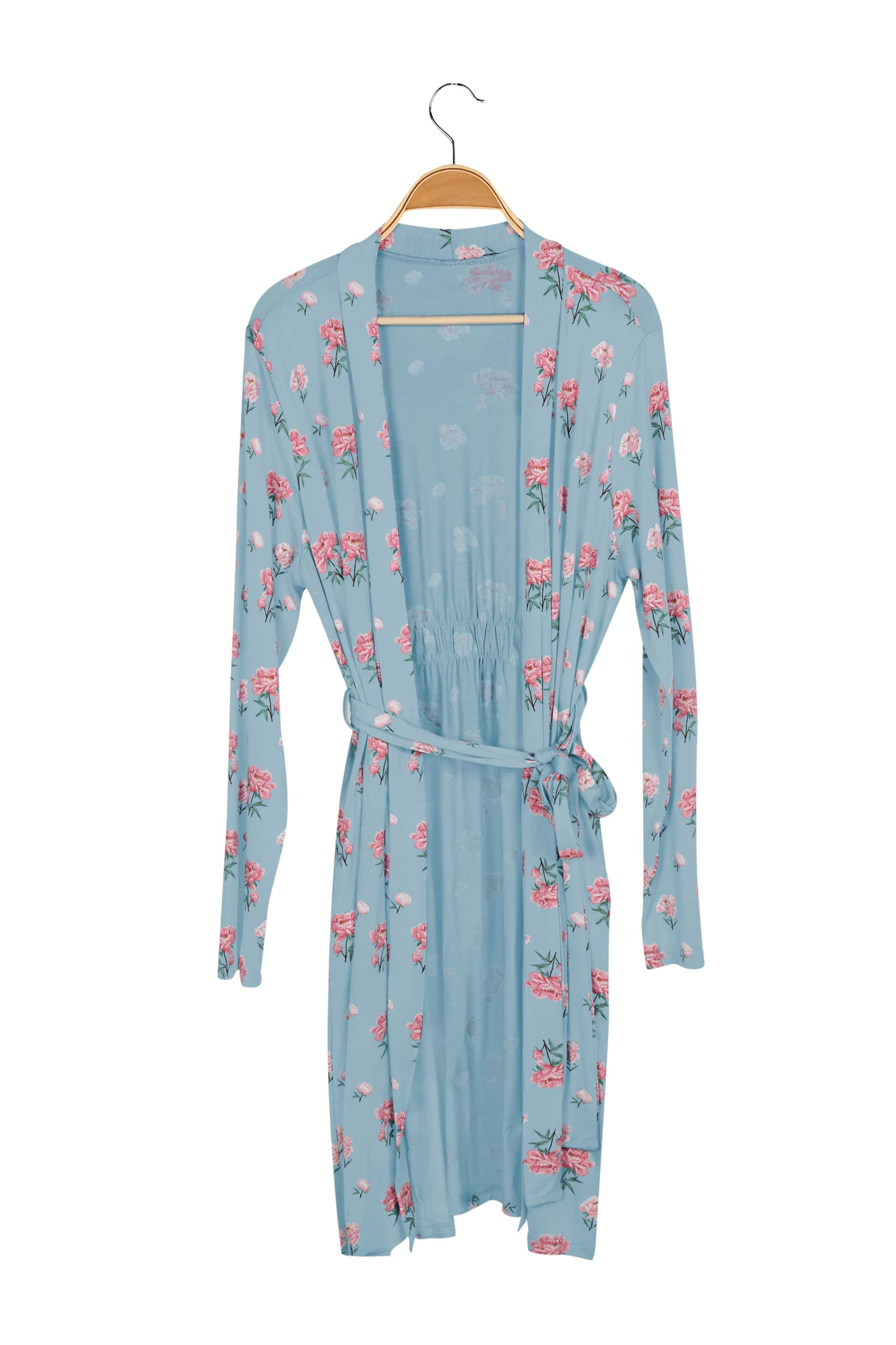 Blue robe with pink peony floral pattern on a hanger