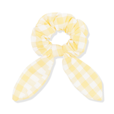 gingham yellow scrunchie on white background