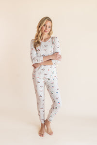 Model wearing Women's Jogger Pajama Set in Vanilla Mahjong print on a beige background