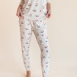 Close up of Model wearing Women's Jogger Pajama Set in Vanilla Mahjong print on a beige background