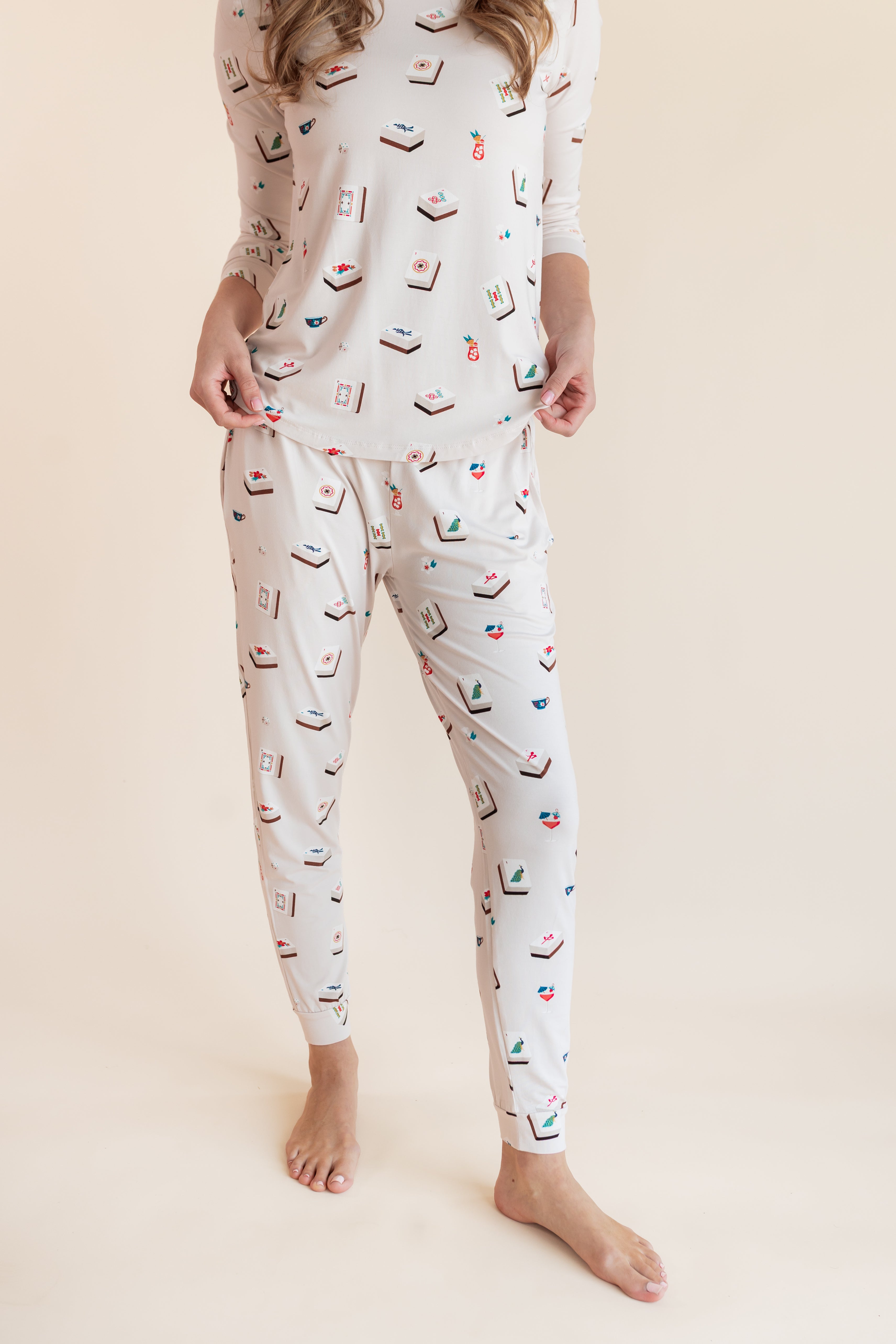Close up of Model wearing Women's Jogger Pajama Set in Vanilla Mahjong print on a beige background