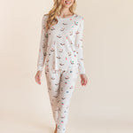 Model posing in Women's Jogger Pajama Set in Vanilla Mahjong print on a beige background
