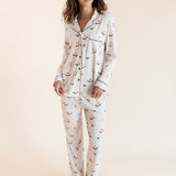 Model wearing Long-Sleeved Women's Pajama Set in Vanilla Mahjong print with brown trim on a beige background
::: Model is 5'9.5" wearing size XS ///
---PJ 4