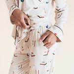Model showcasing pockets on Long-Sleeved Women's Pajama Set in Vanilla Mahjong print on a beige background
---1605 1