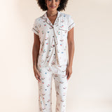 Model smiling in Women's Short Sleeve Cropped Pajama Set in Vanilla Mahjong print on a beige background
---1620 1