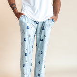 Modal wearing Men's Lounge Pants in Vintage Hockey print under a white T-shirt on a beige background
::: Model is 6'2" wearing size L ///