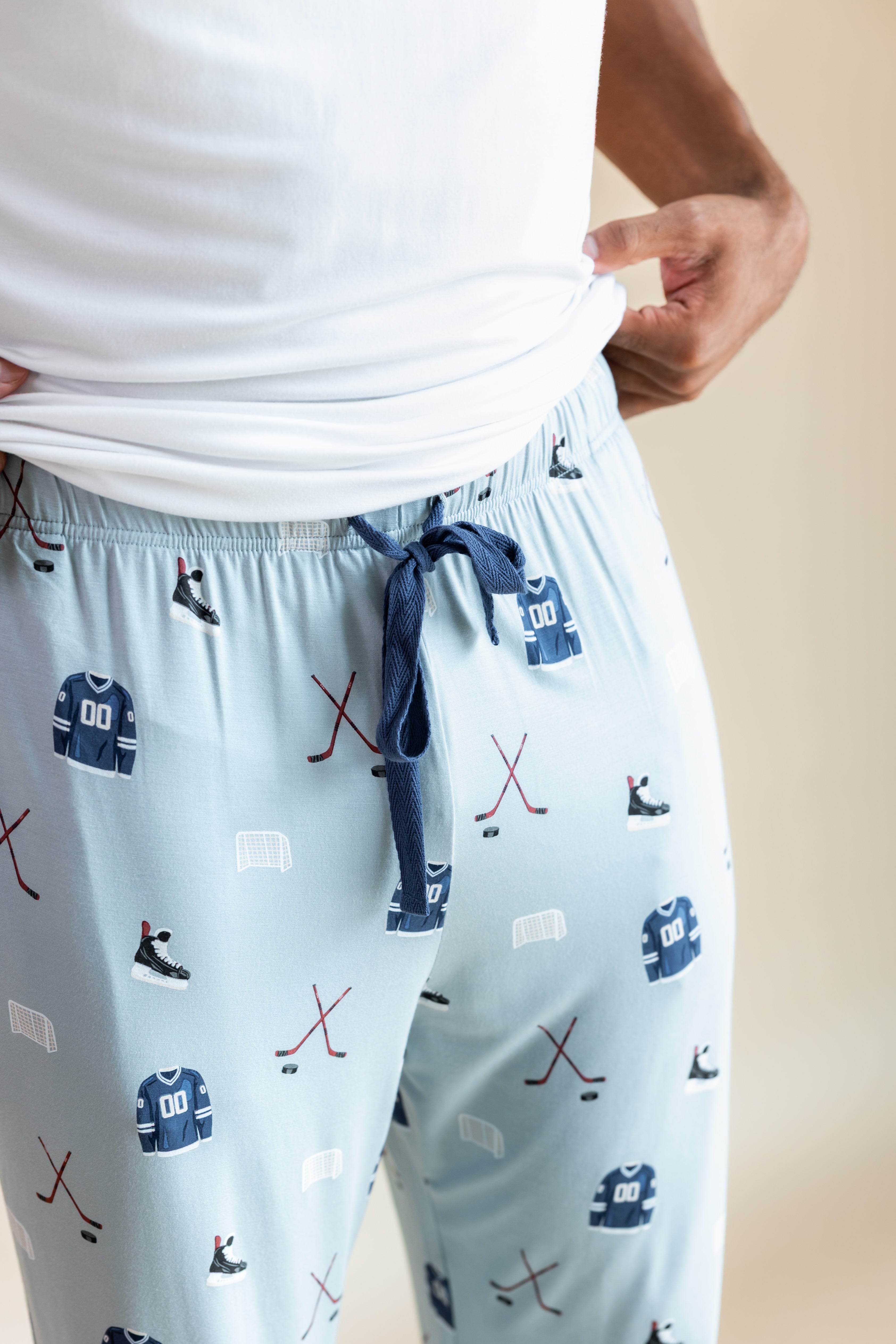 Modal showcasing the drawstring on Men's Lounge Pants in Vintage Hockey print on a beige background