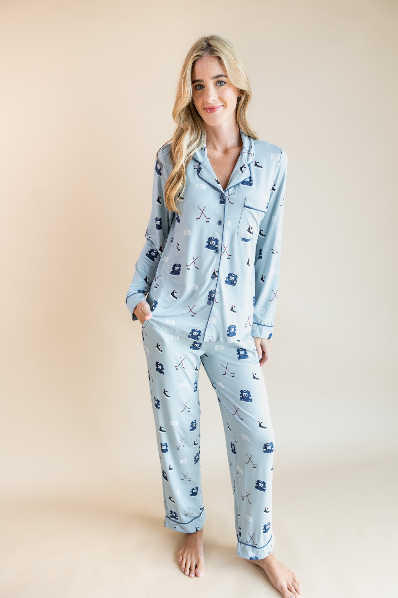 Modal wearing Long-Sleeved Women's Pajama Set in Vintage Hockey print on a beige background
