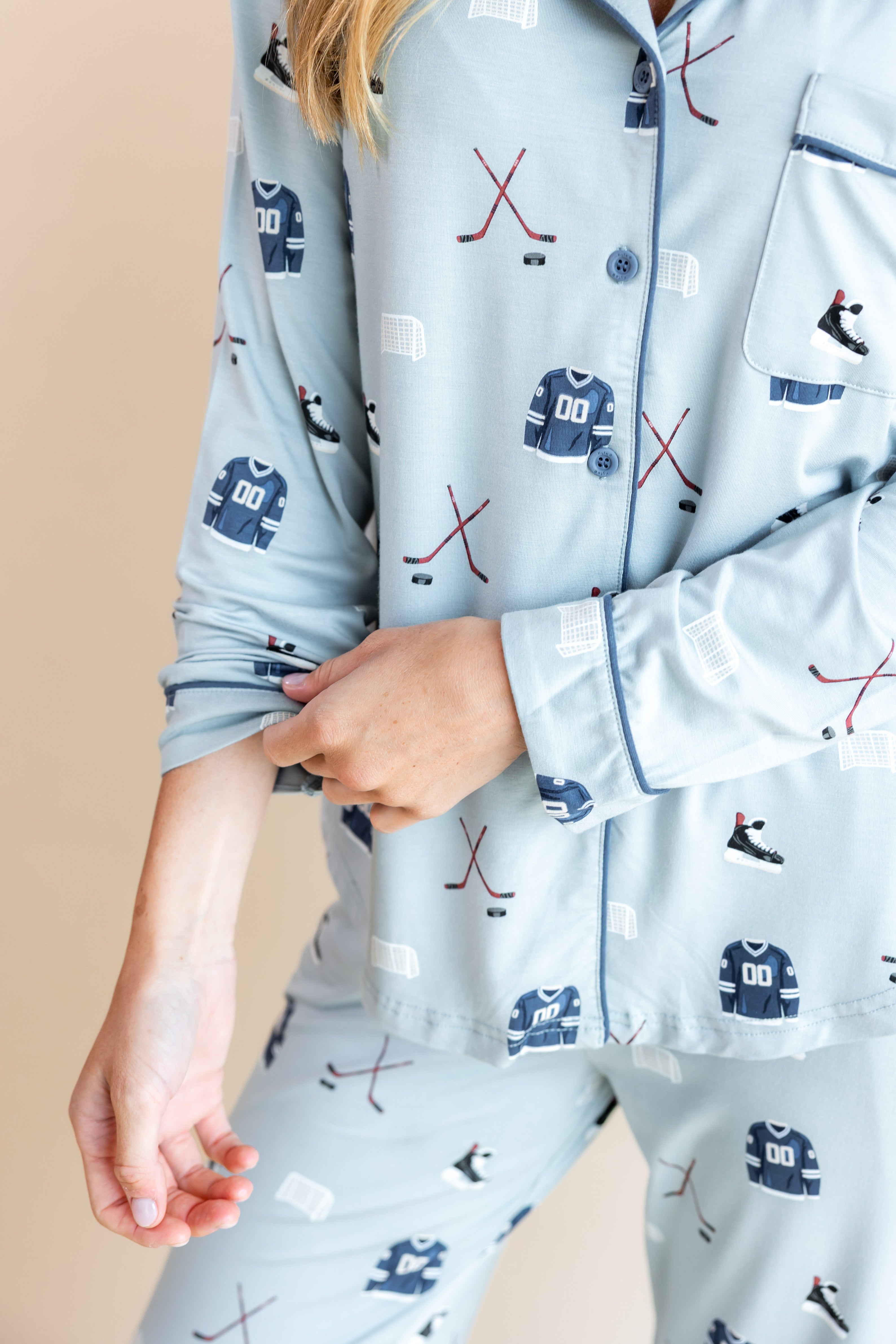 Modal showcasing the sleeves of Long-Sleeved Women's Pajama Set in Vintage Hockey print on a beige background
---1605 1