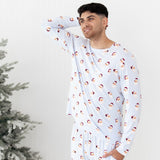 Male model standing looking off to the side with one hand behind his head and the other in the pants pocket of the Men's Jogger Set in Vintage Santa