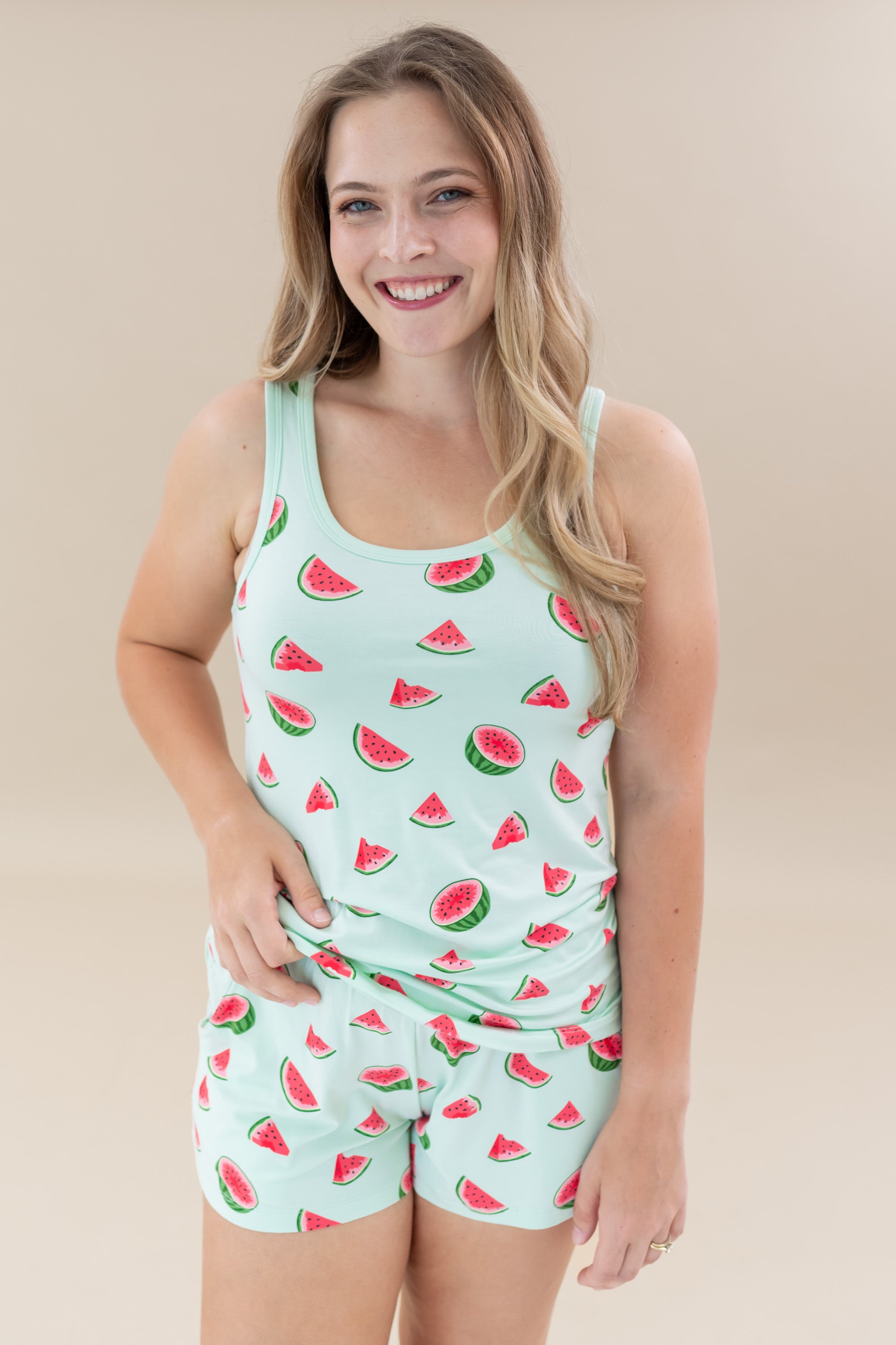 Smiling female wearing the Women’s Tank Set in Watermelon