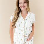 Woman smiling and modeling Women’s Short Sleeve Pajama Set in Wildflower