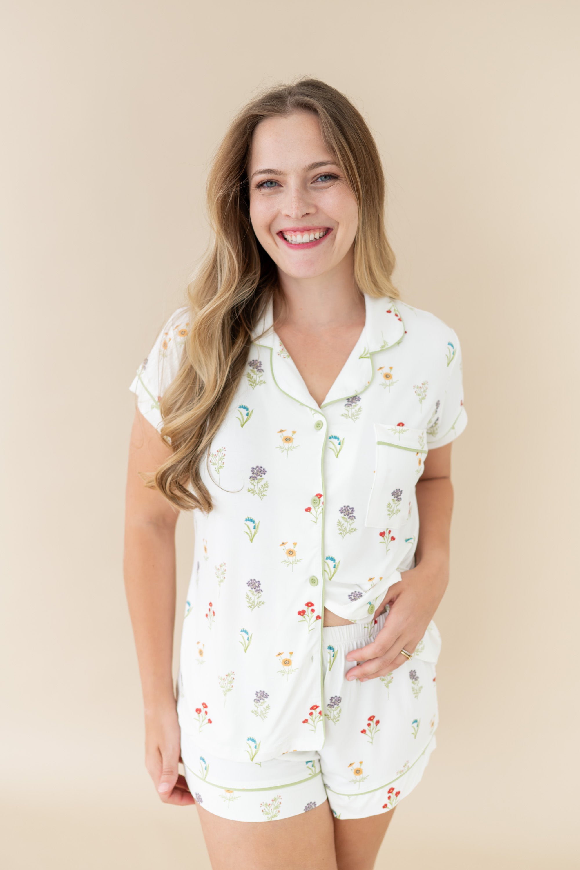 Woman smiling and modeling Women’s Short Sleeve Pajama Set in Wildflower