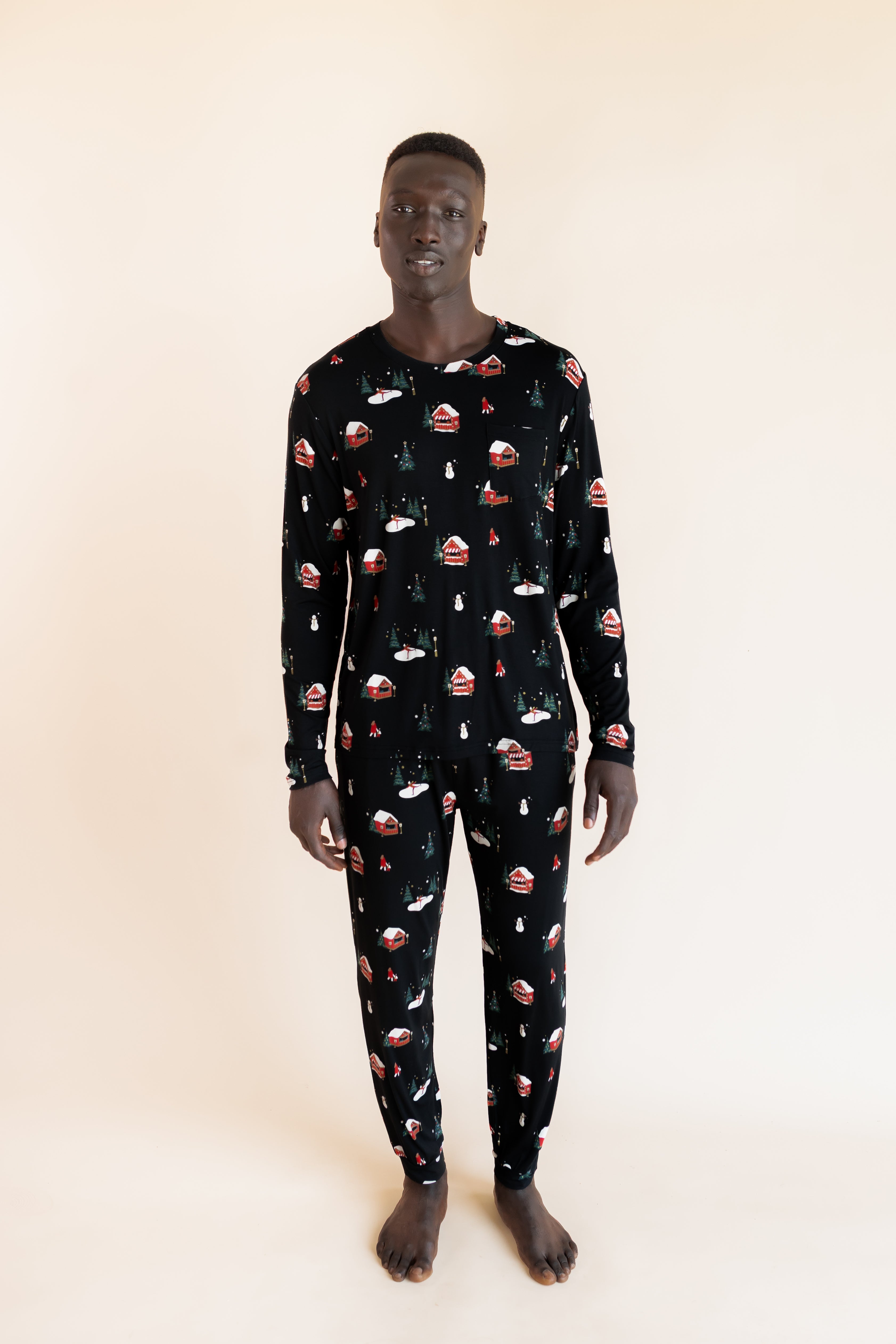 Man standing wearing a jogger set in winter wonderland
::: Model is 6'1" wearing size L ///