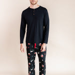 Man standing wearing a long sleeve shirt and lounge pants in winter wonderland
::: Model is 6'3" wearing size L ///