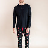 Man standing wearing a long sleeve shirt and lounge pants in winter wonderland
::: Model is 6'3" wearing size L ///