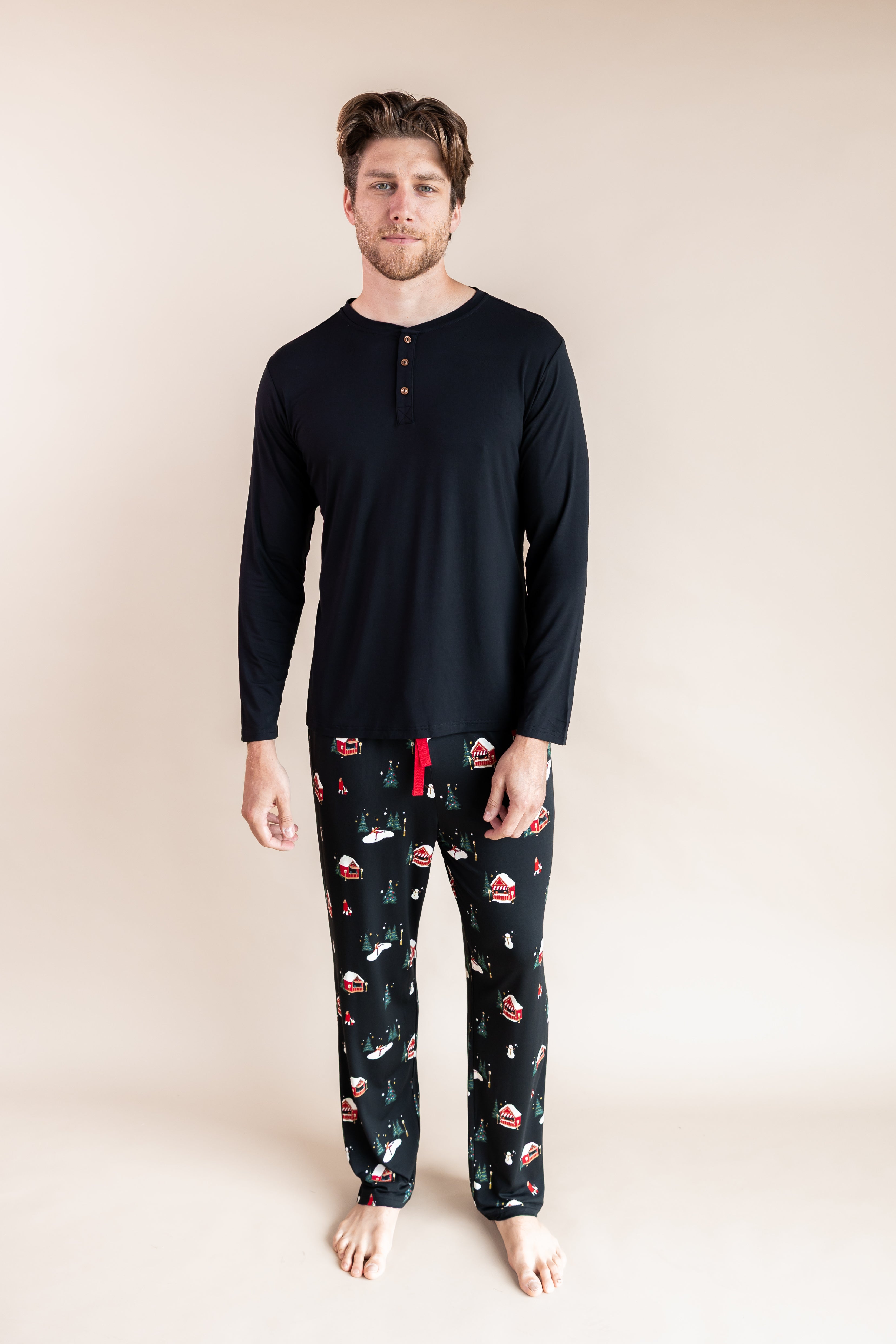 Man standing wearing a long sleeve shirt and lounge pants in winter wonderland
::: Model is 6'3" wearing size L ///
