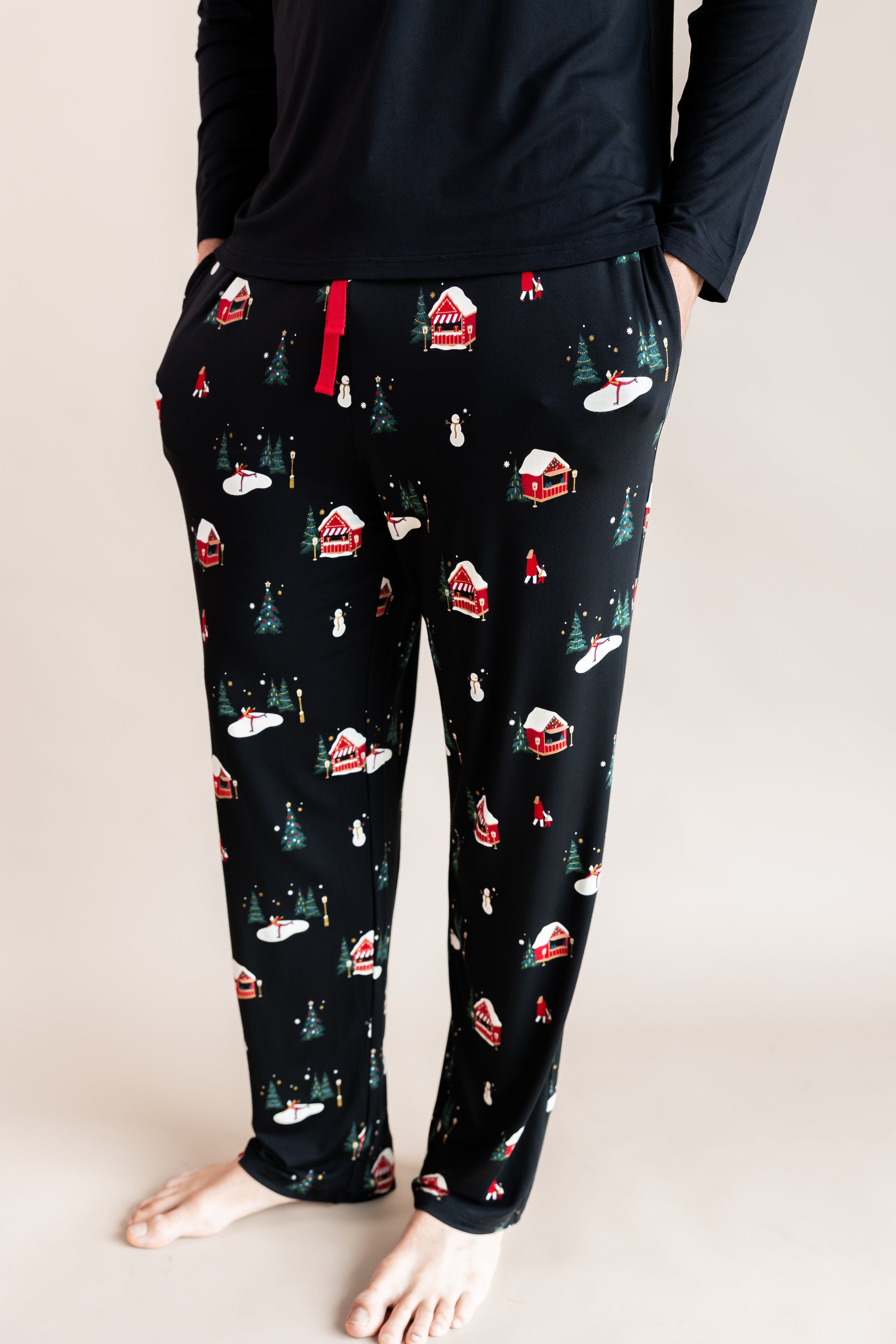 males leges with his hand sin his pockets wearing lounge pants in winter wonderland
