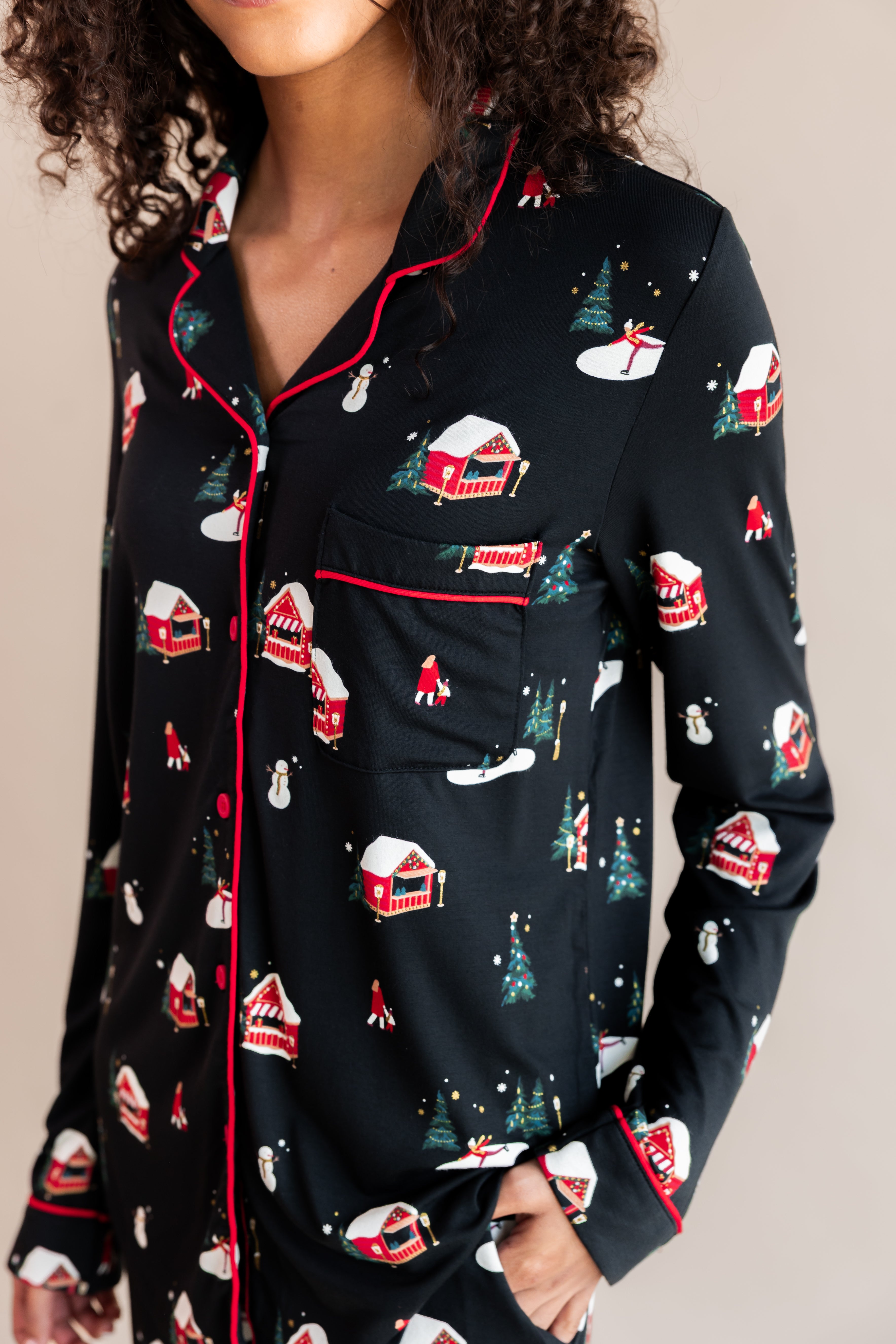 Womans top half with her hand in her pajama pocket in winter wonderland long sleeve pajama set

---PJ 2