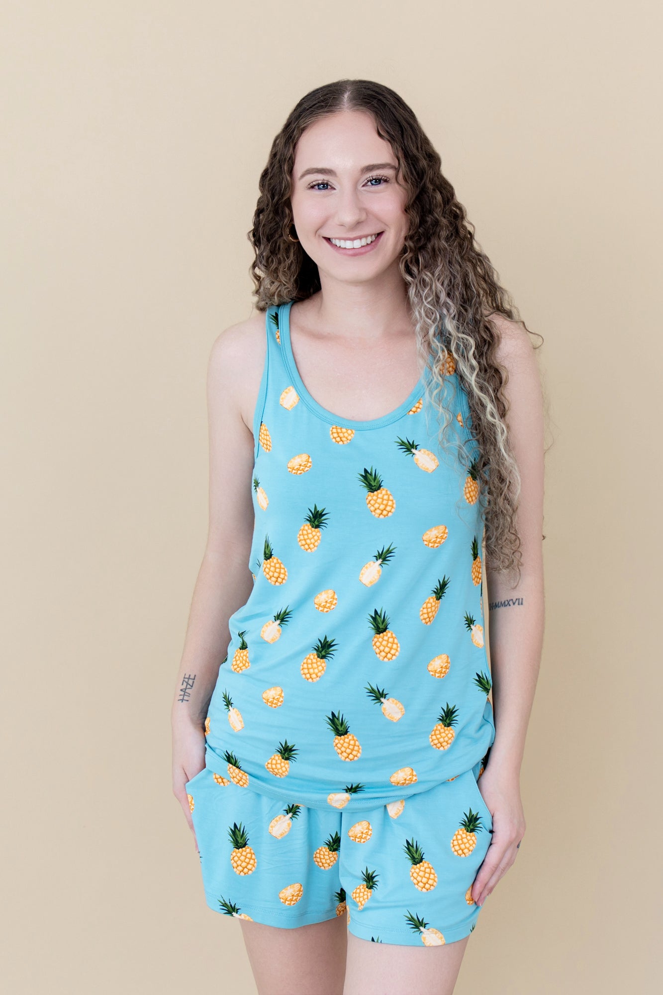 Woman modeling Women’s Tank Set in Pineapple close up