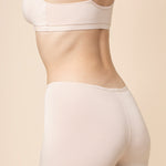 Model show casing the back side of the Women's Boxer in Blonde and of the matching bra