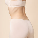 Model show casing the back side of the Women's Boxer in Blonde and of the matching bra
