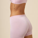 Close up of the backside of the Women's Boxer in Peony on a model paired with the matching bra