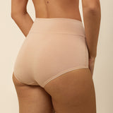 Beige high-waisted underwear on a neutral background