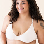 Woman wearing Blonde Nursing Bra with a plain background