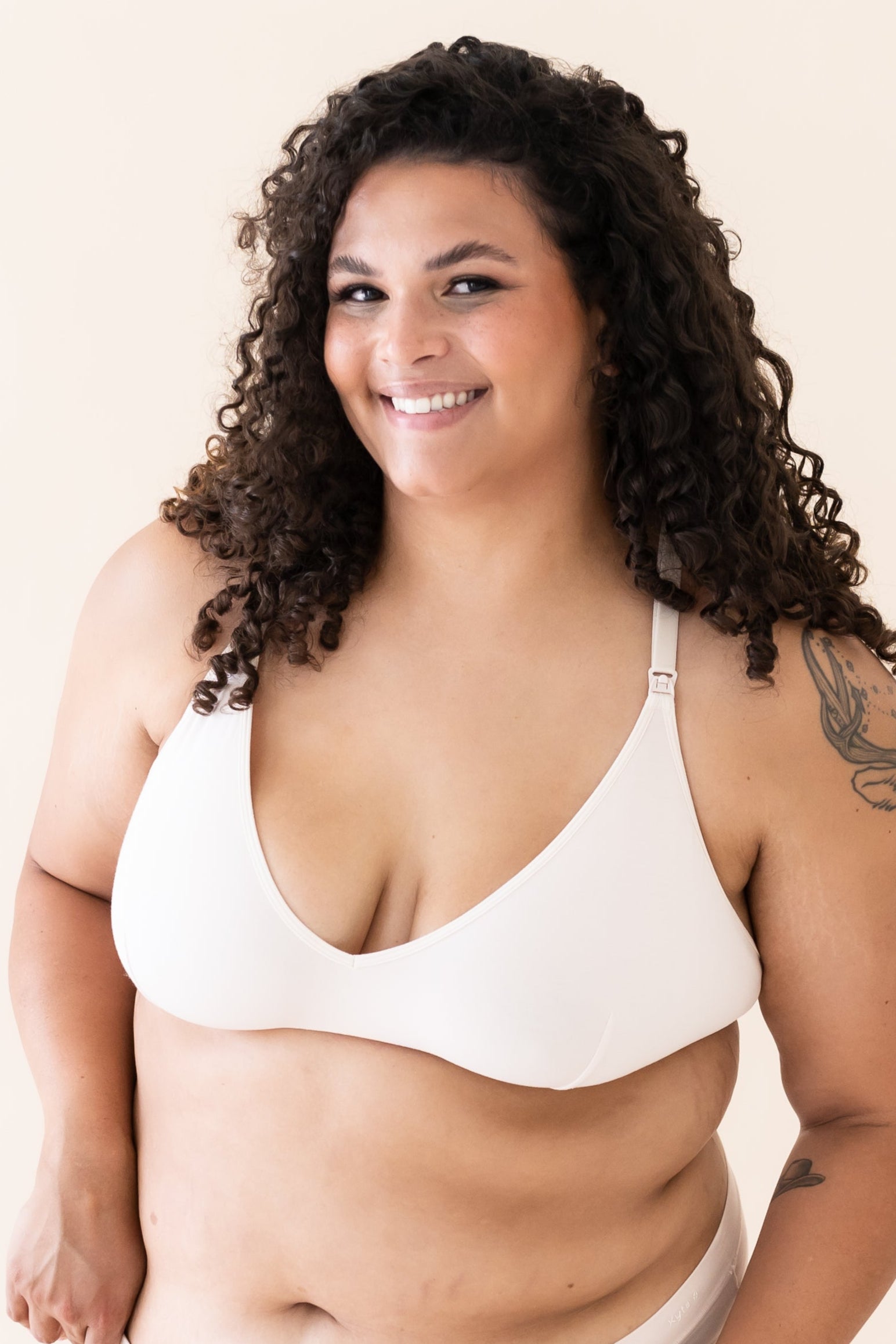 Woman wearing Blonde Nursing Bra with a plain background