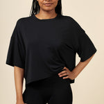 Model posing in Black Women's Boxer paired with matching Tee in Midnight 
::: Model is  wearing size S ///