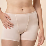 Close up of the Women's Boxer in Blonde on a model standing in front of a beige background 