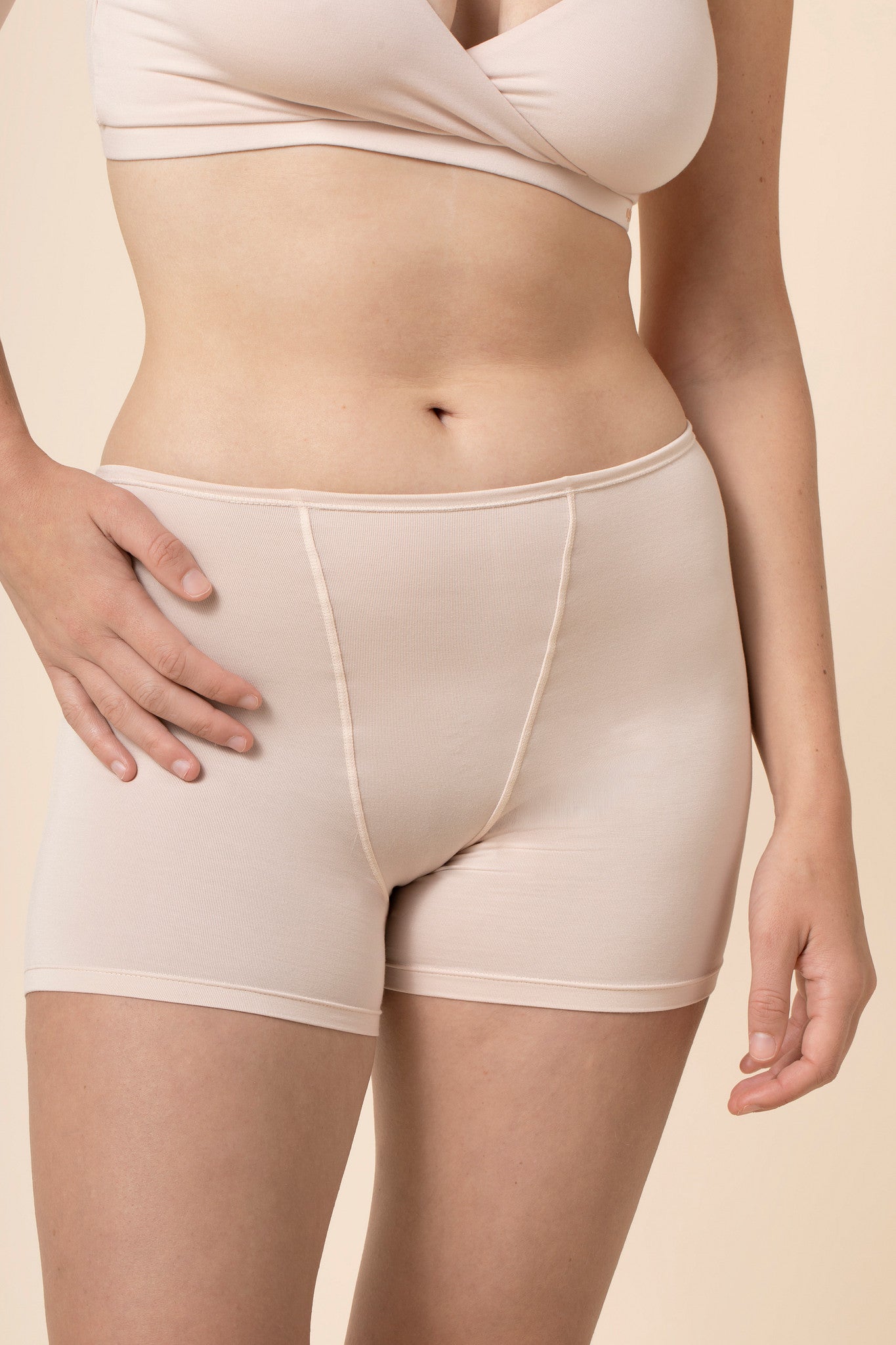 Close up of the Women's Boxer in Blonde on a model standing in front of a beige background 